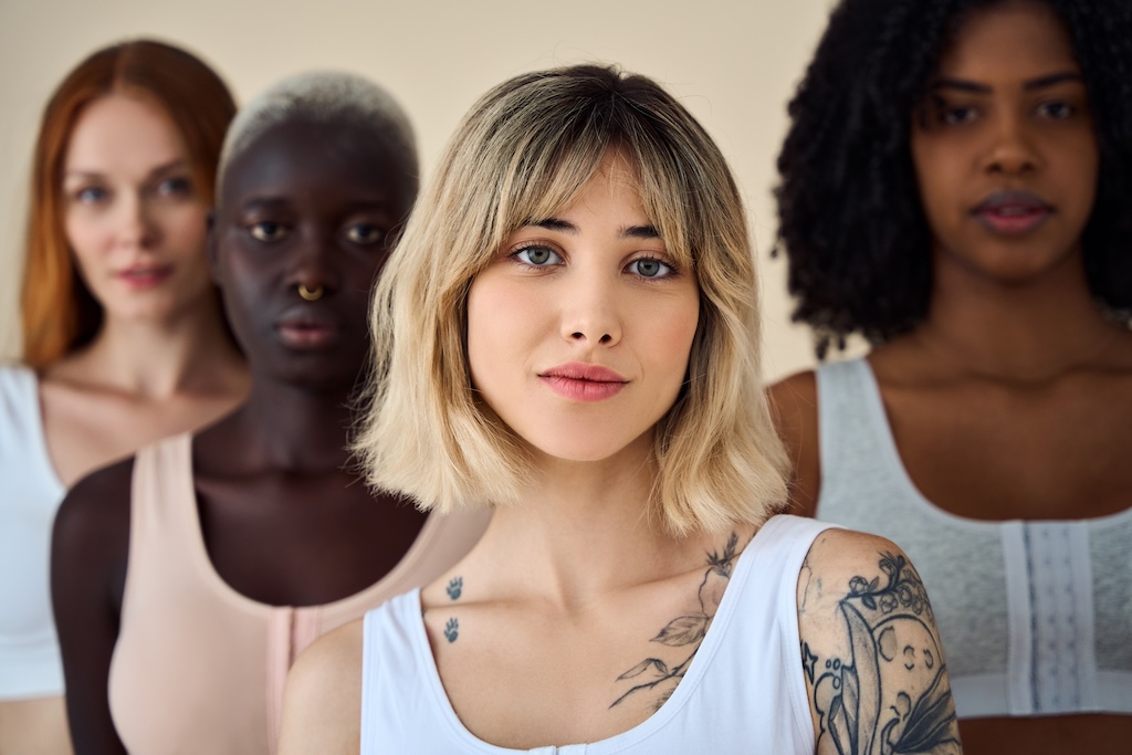 Diverse group of women struggling with PMDD looking head-on at the camera.