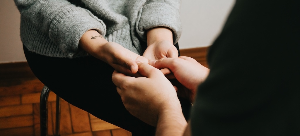 People holding hands, self help and depression concept