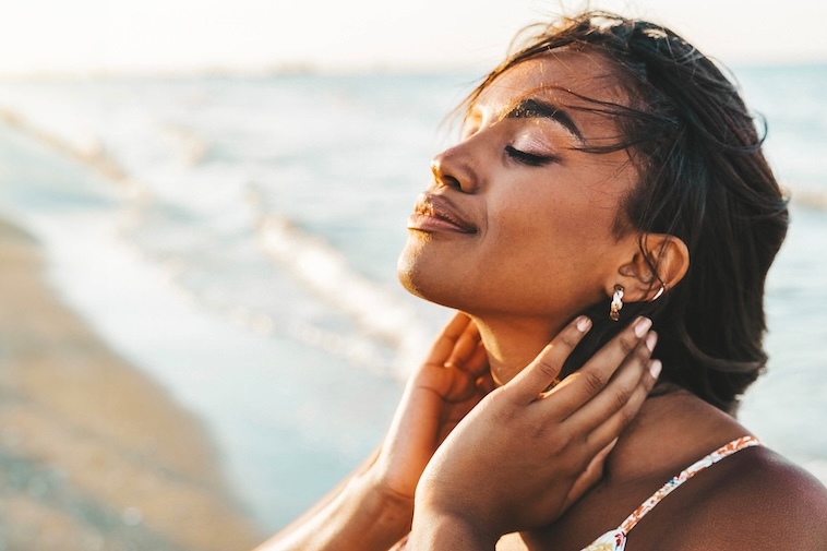 Beautiful female breathing fresh air outside - Health care and wellness concept