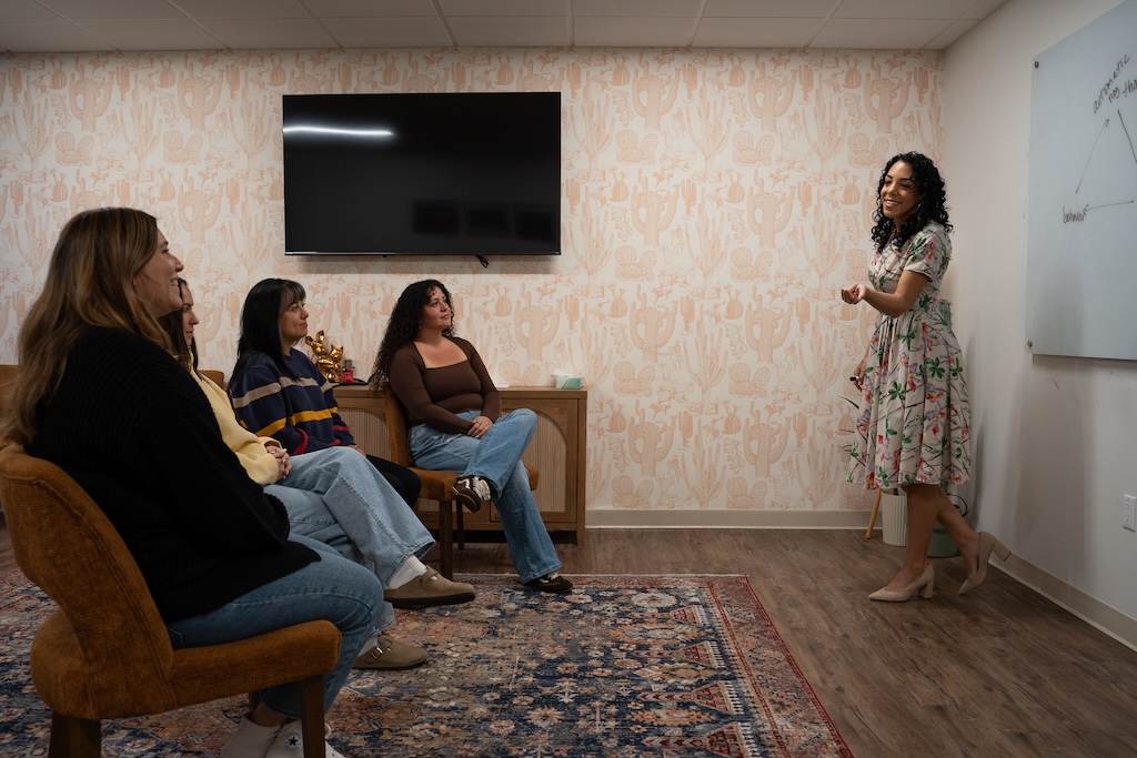 Women participating in a therapist-led group therapy session at Monima Wellness Center in San Diego.
